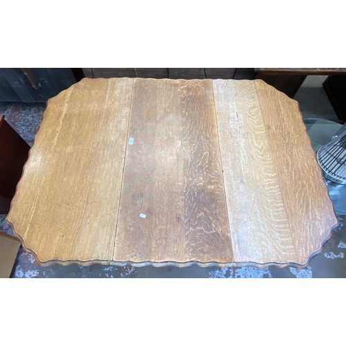 113 - An early 20th century oak pie crust edge drop leaf gate leg barley twist dining table - approx. 72cm... 