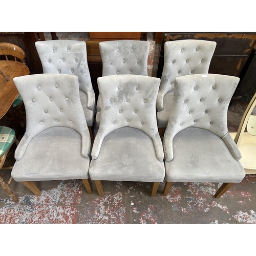 116 - Six modern grey buttoned fabric upholstered dining chairs on beech supports with metal studding