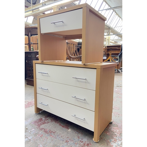 119 - Two pieces of modern white laminate and beech effect bedroom furniture, one chest of drawers and one... 