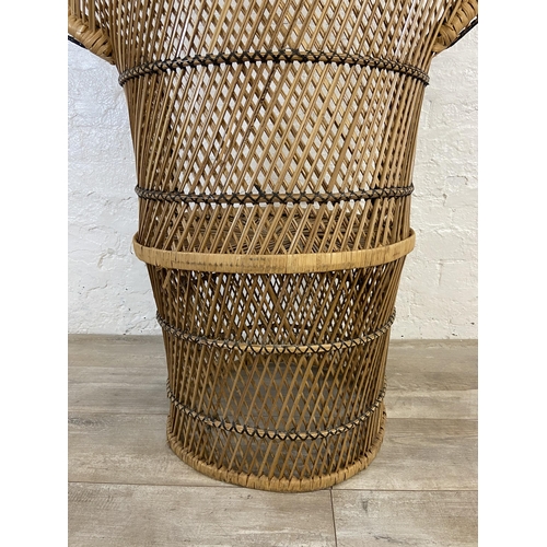 12 - A mid 20th century wicker peacock chair - approx. 134cm high x 91cm wide x 48cm deep