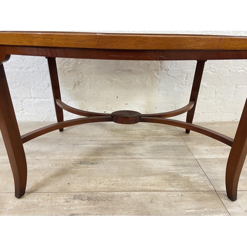 121 - A Regency style inlaid yew wood and mahogany oval coffee table - approx. 52cm high x 64cm wide x 112... 