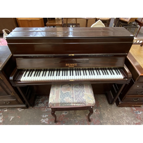 123 - An early 20th century Brinnie of London mahogany upright piano with stool - approx. 110cm high x 135... 