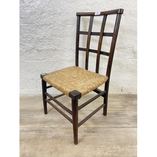 124 - An Arts & Crafts Liberty & Co style beech lattice back and rush seated child's chair - approx. 65cm ... 