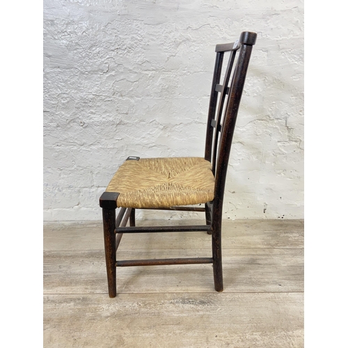 124 - An Arts & Crafts Liberty & Co style beech lattice back and rush seated child's chair - approx. 65cm ... 