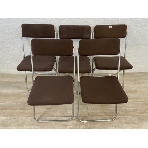 136 - Five mid 20th century brown fabric and chrome plated folding chairs