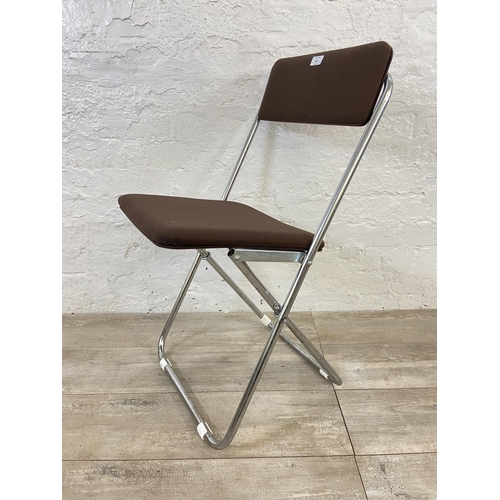 136 - Five mid 20th century brown fabric and chrome plated folding chairs