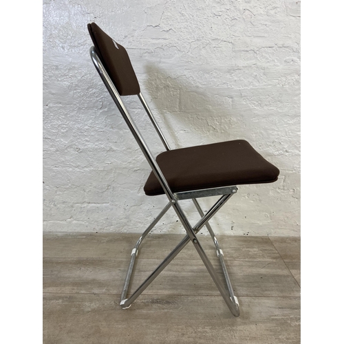 136 - Five mid 20th century brown fabric and chrome plated folding chairs