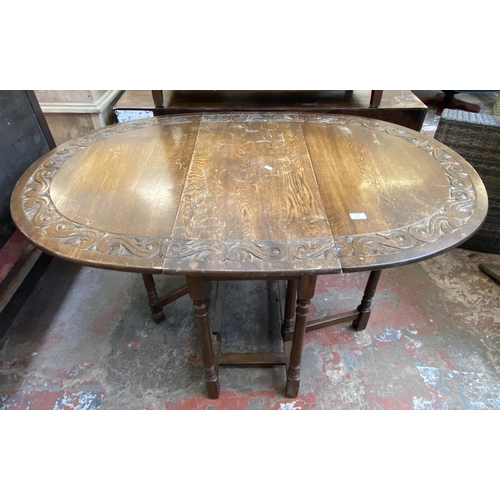 137 - Five pieces of furniture, one carved oak drop leaf gate leg oval dining table - approx. 76cm high x ... 