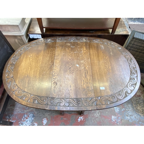 137 - Five pieces of furniture, one carved oak drop leaf gate leg oval dining table - approx. 76cm high x ... 