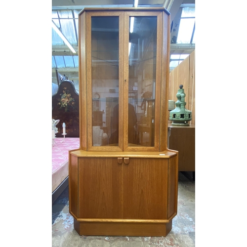 147 - A mid 20th century Turnidge of London teak free standing corner display cabinet - approx. 170cm high... 