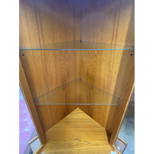 147 - A mid 20th century Turnidge of London teak free standing corner display cabinet - approx. 170cm high... 