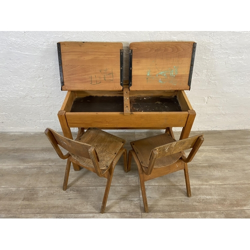 15 - A mid 20th century beech twin child's school desk and two bentwood child's chairs - approx. 62cm hig... 