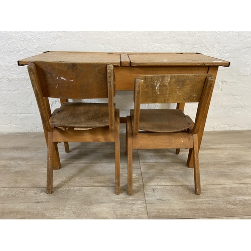 15 - A mid 20th century beech twin child's school desk and two bentwood child's chairs - approx. 62cm hig... 