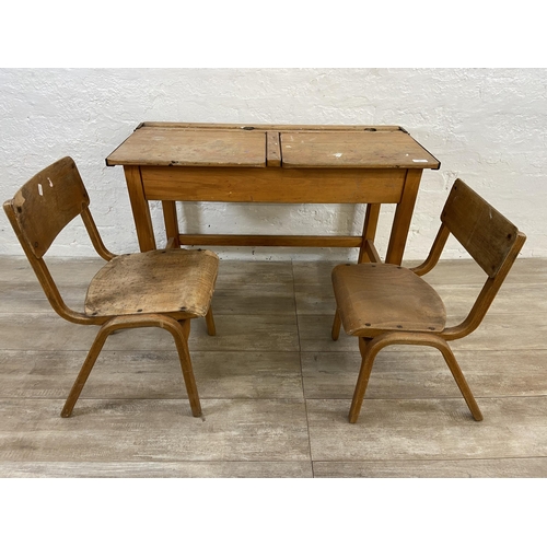 15 - A mid 20th century beech twin child's school desk and two bentwood child's chairs - approx. 62cm hig... 