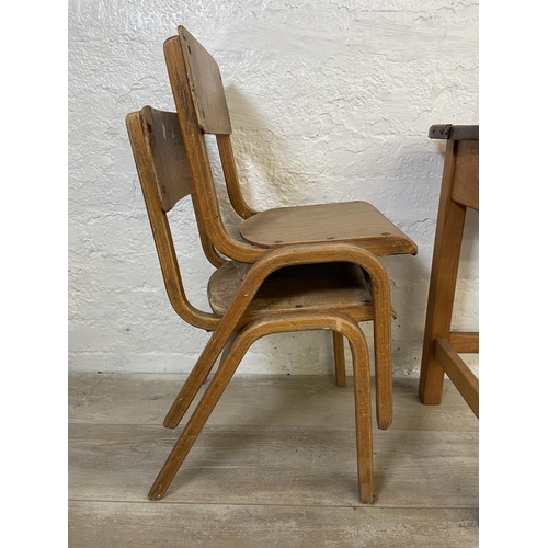 15 - A mid 20th century beech twin child's school desk and two bentwood child's chairs - approx. 62cm hig... 