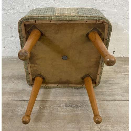 150 - A mid 20th century vinyl upholstered footstool on beech supports - approx. 40cm high x 40cm wide x 4... 