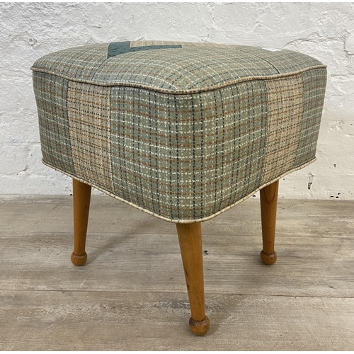 150 - A mid 20th century vinyl upholstered footstool on beech supports - approx. 40cm high x 40cm wide x 4... 