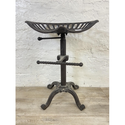 153 - A cast iron adjustable tractor seat stool - approx. 66cm high