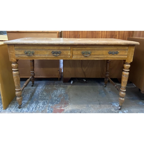 154 - A Victorian Aesthetic Movement satinwood two drawer writing table - approx. 74cm high x 122cm wide x... 