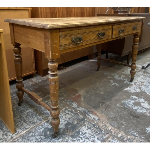 154 - A Victorian Aesthetic Movement satinwood two drawer writing table - approx. 74cm high x 122cm wide x... 