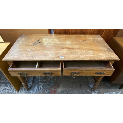 154 - A Victorian Aesthetic Movement satinwood two drawer writing table - approx. 74cm high x 122cm wide x... 