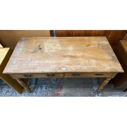 154 - A Victorian Aesthetic Movement satinwood two drawer writing table - approx. 74cm high x 122cm wide x... 