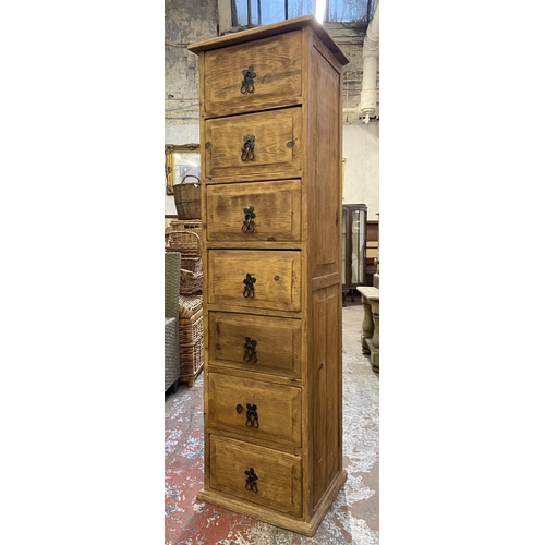 155 - A pine chest of drawers - approx. 137cm high x 39cm wide x 34cm deep