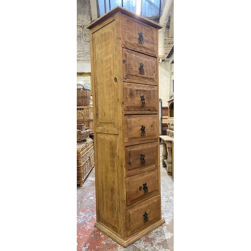 155 - A pine chest of drawers - approx. 137cm high x 39cm wide x 34cm deep