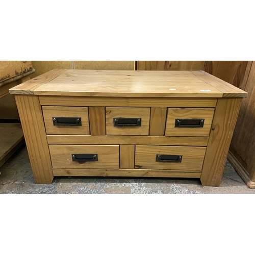 157 - A Mexican pine rectangular five drawer coffee table - approx. 46cm high x 50cm wide x 90cm deep