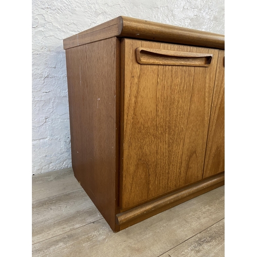 16 - A mid 20th century Meredew teak low sideboard - approx. 56cm high x 135cm wide x 45cm deep