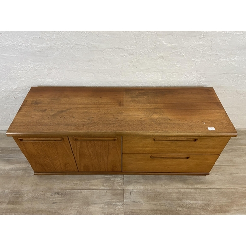 16 - A mid 20th century Meredew teak low sideboard - approx. 56cm high x 135cm wide x 45cm deep