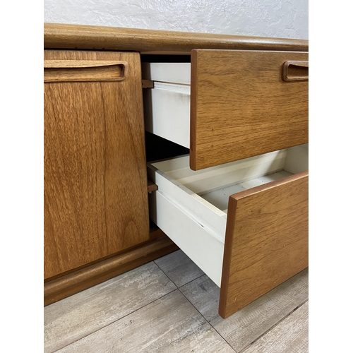 16 - A mid 20th century Meredew teak low sideboard - approx. 56cm high x 135cm wide x 45cm deep