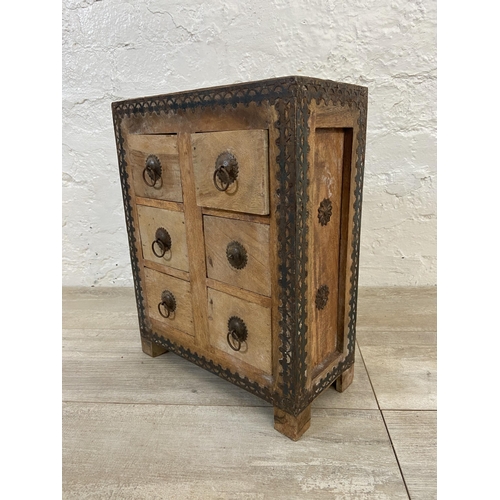 18 - An Indian hardwood six drawer spice cabinet/miniature chest of drawers with metal decoration - appro... 