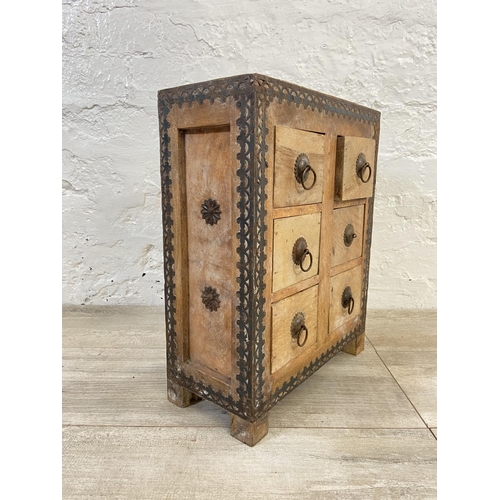 18 - An Indian hardwood six drawer spice cabinet/miniature chest of drawers with metal decoration - appro... 