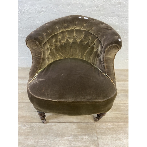 22 - A 19th century green fabric button back upholstered armchair/salon chair on turned mahogany supports... 