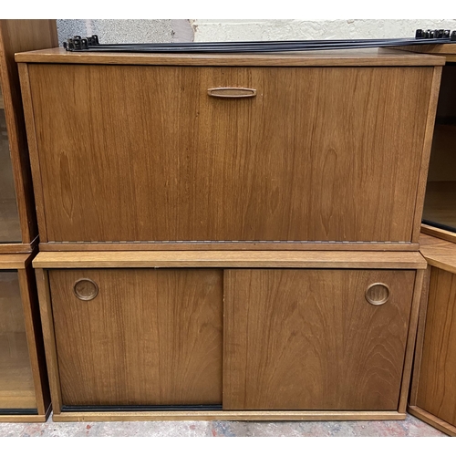 23 - A mid 20th century Avalon Modula teak three bay wall system