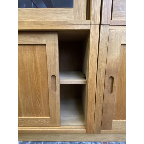 27 - A Laura Ashley Milton oak compartmental storage system - approx. 129cm high x 221cm wide x 40cm deep