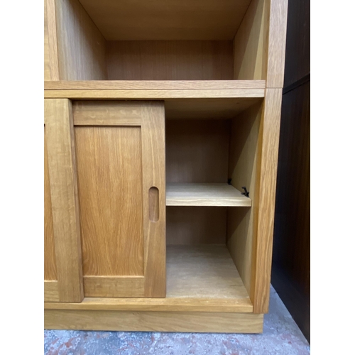 27 - A Laura Ashley Milton oak compartmental storage system - approx. 129cm high x 221cm wide x 40cm deep