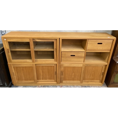 27 - A Laura Ashley Milton oak compartmental storage system - approx. 129cm high x 221cm wide x 40cm deep