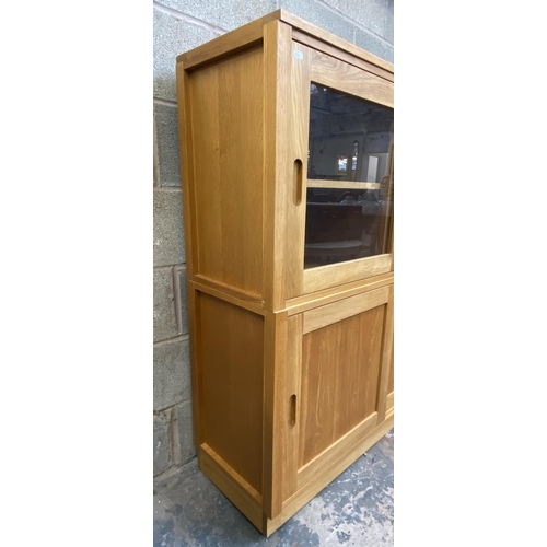 27 - A Laura Ashley Milton oak compartmental storage system - approx. 129cm high x 221cm wide x 40cm deep