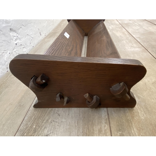 28 - An early 20th century oak book trough - approx. 14cm high x 61cm wide x 24cm deep