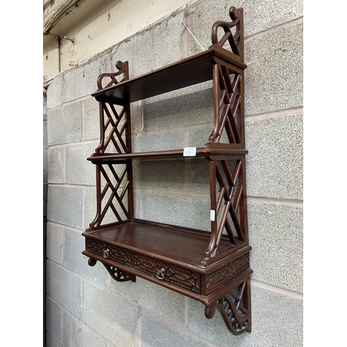 33 - A Chippendale style carved mahogany three tier wall hanging shelf - approx. 87cm high x 54cm wide x ... 