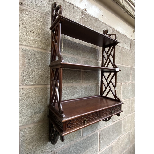 33 - A Chippendale style carved mahogany three tier wall hanging shelf - approx. 87cm high x 54cm wide x ... 