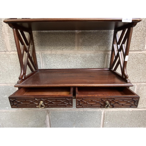 33 - A Chippendale style carved mahogany three tier wall hanging shelf - approx. 87cm high x 54cm wide x ... 