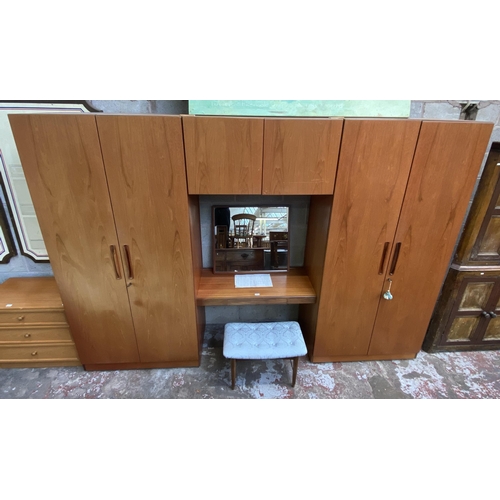 37 - A mid 20th century G Plan Fresco teak wardrobe system - approx. 214cm high x 304cm wide x 56cm deep