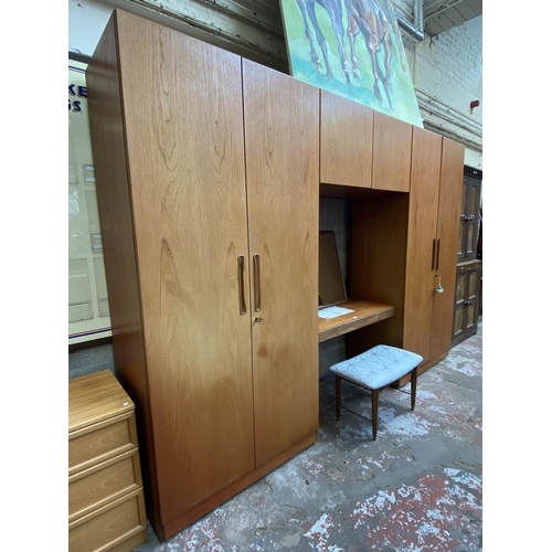 37 - A mid 20th century G Plan Fresco teak wardrobe system - approx. 214cm high x 304cm wide x 56cm deep