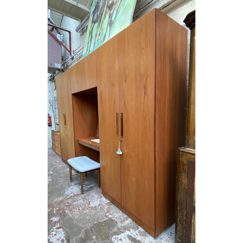 37 - A mid 20th century G Plan Fresco teak wardrobe system - approx. 214cm high x 304cm wide x 56cm deep