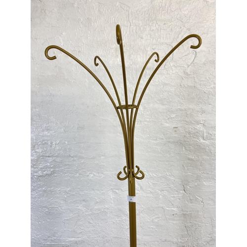 40 - A modern gilt wrought metal coat stand - approx. 177cm high