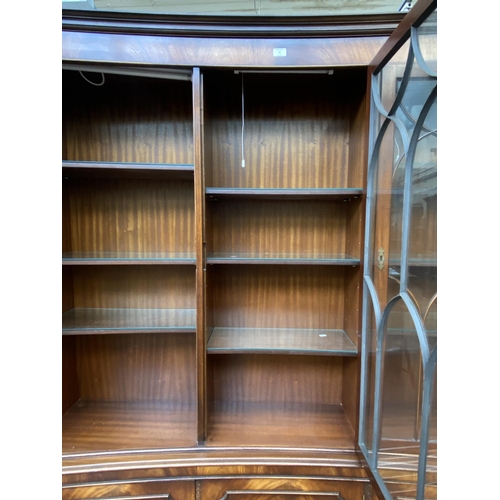 41 - A Bevan Funnell Ltd Reprodux mahogany glazed concave bookcase/display cabinet - approx. 205cm high x... 