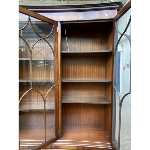 41 - A Bevan Funnell Ltd Reprodux mahogany glazed concave bookcase/display cabinet - approx. 205cm high x... 